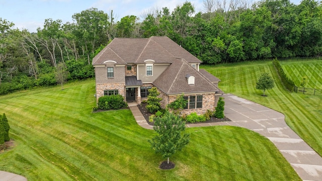 9488 Stillbrook Trce, Brentwood, TN 37027 - french country style house with stone siding, a front yard, and a shingled roof