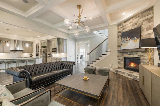 9488 Stillbrook Trce, Brentwood, TN 37027 - living room featuring a stone fireplace, dark wood-style floors, ornamental molding, coffered ceiling, and beamed ceiling