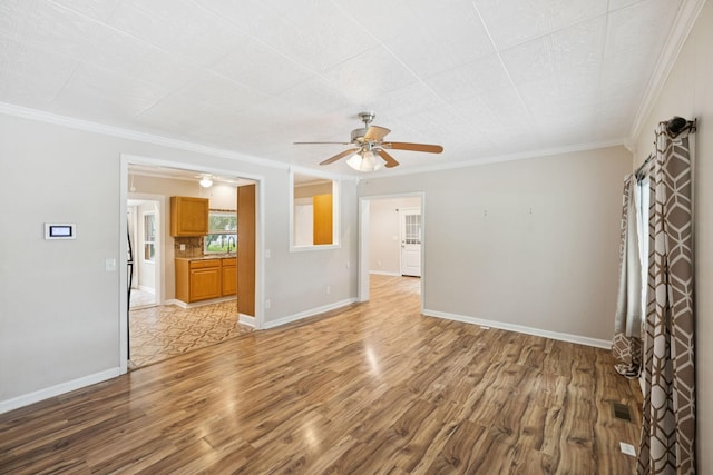 631 W Maple St, Morrison, TN 37357 - unfurnished living room with light wood-style floors, a ceiling fan, and crown molding