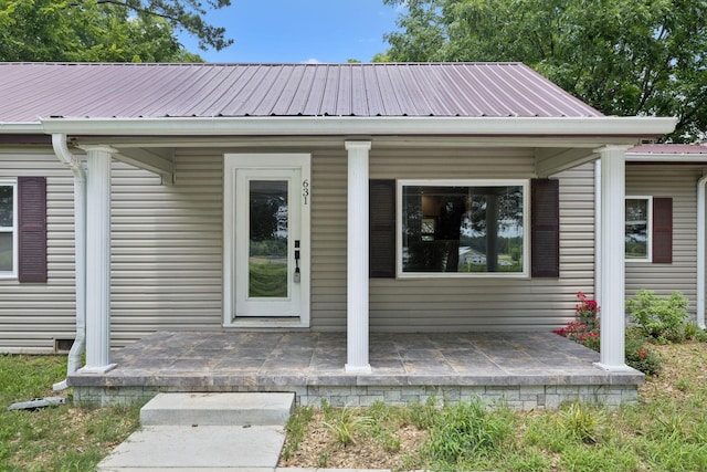 631 W Maple St, Morrison, TN 37357 - doorway to property featuring a metal roof and covered porch