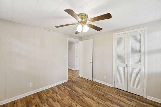 631 W Maple St, Morrison, TN 37357 - unfurnished bedroom with wood finished floors, a closet, and ceiling fan