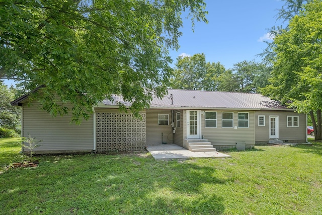 631 W Maple St, Morrison, TN 37357 - back of house featuring entry steps, a lawn, a metal roof, a patio area, and crawl space