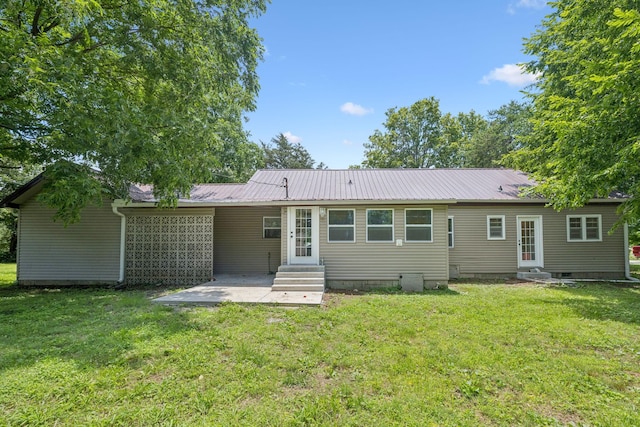 631 W Maple St, Morrison, TN 37357 - rear view of house with entry steps, a patio, and a metal roof