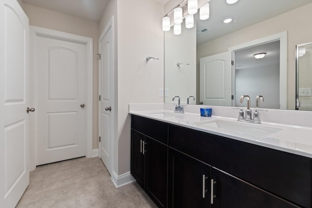 858 Longleaf Ln, Columbia, TN 38401 - bathroom featuring double vanity and baseboards