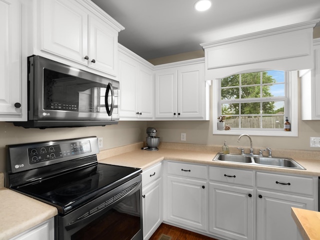 1908 Sheffield Ln, Columbia, TN 38401 - kitchen featuring electric range oven, stainless steel microwave, white cabinetry, and light countertops