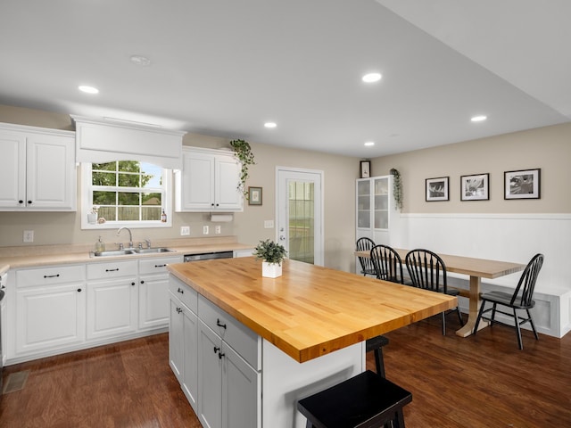 1908 Sheffield Ln, Columbia, TN 38401 - kitchen with wooden counters, a kitchen bar, white cabinetry, dark wood-type flooring, and recessed lighting