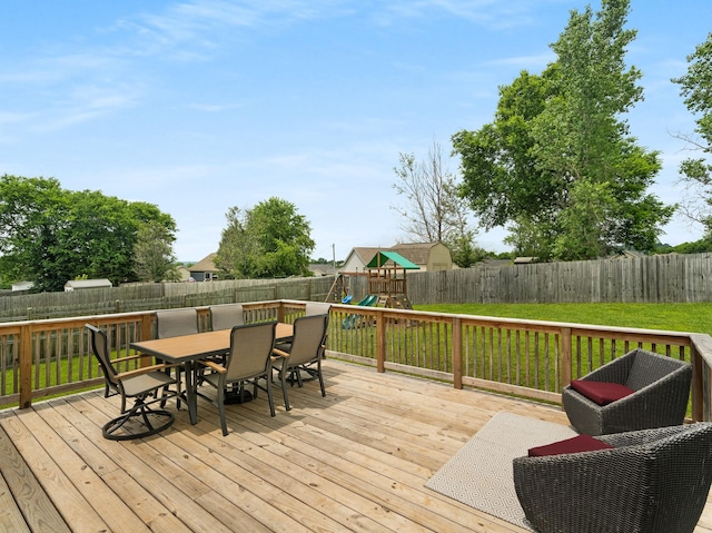 1908 Sheffield Ln, Columbia, TN 38401 - wooden deck with outdoor dining space, a playground, and a fenced backyard