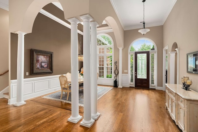 241 King Arthur Cir, Franklin, TN 37067 - entryway with wood finished floors, ornamental molding, a wainscoted wall, and a towering ceiling