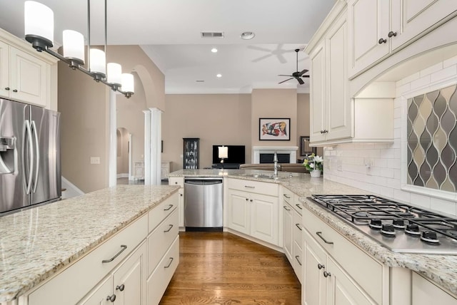 241 King Arthur Cir, Franklin, TN 37067 - kitchen with appliances with stainless steel finishes, ceiling fan, decorative columns, tasteful backsplash, and recessed lighting