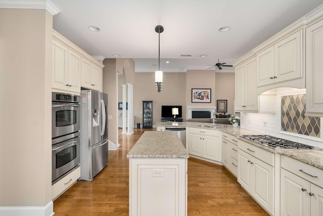 241 King Arthur Cir, Franklin, TN 37067 - kitchen featuring stainless steel appliances, open floor plan, backsplash, recessed lighting, and a peninsula