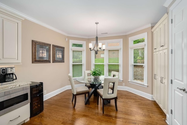 241 King Arthur Cir, Franklin, TN 37067 - dining area with a chandelier, dark wood-type flooring, and ornamental molding