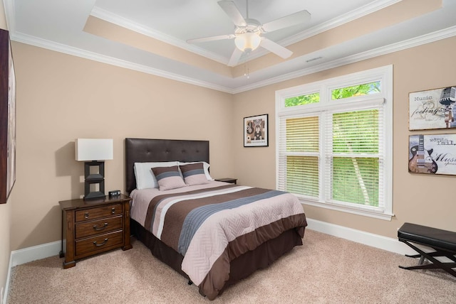 241 King Arthur Cir, Franklin, TN 37067 - bedroom featuring a tray ceiling, multiple windows, light colored carpet, ornamental molding, and ceiling fan