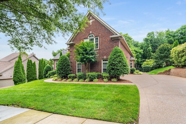 241 King Arthur Cir, Franklin, TN 37067 - view of front of home with brick siding, a front yard, and concrete driveway