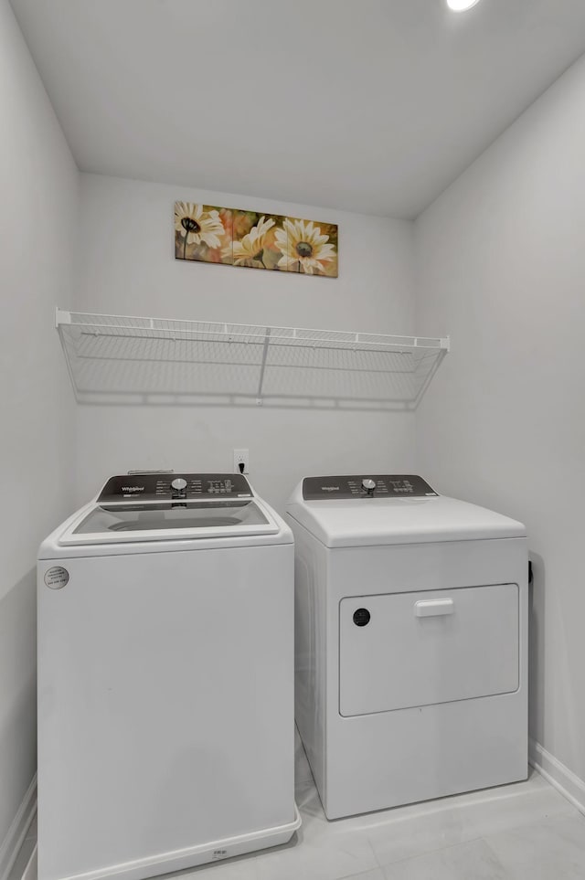 120 Millbrook Dr, Spring Hill, TN 37174 - laundry room featuring washing machine and clothes dryer and light marble finish floors