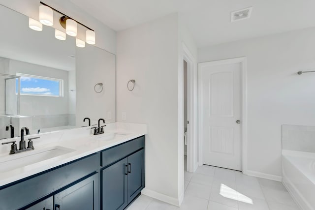 120 Millbrook Dr, Spring Hill, TN 37174 - bathroom with a bath, double vanity, and tile patterned flooring