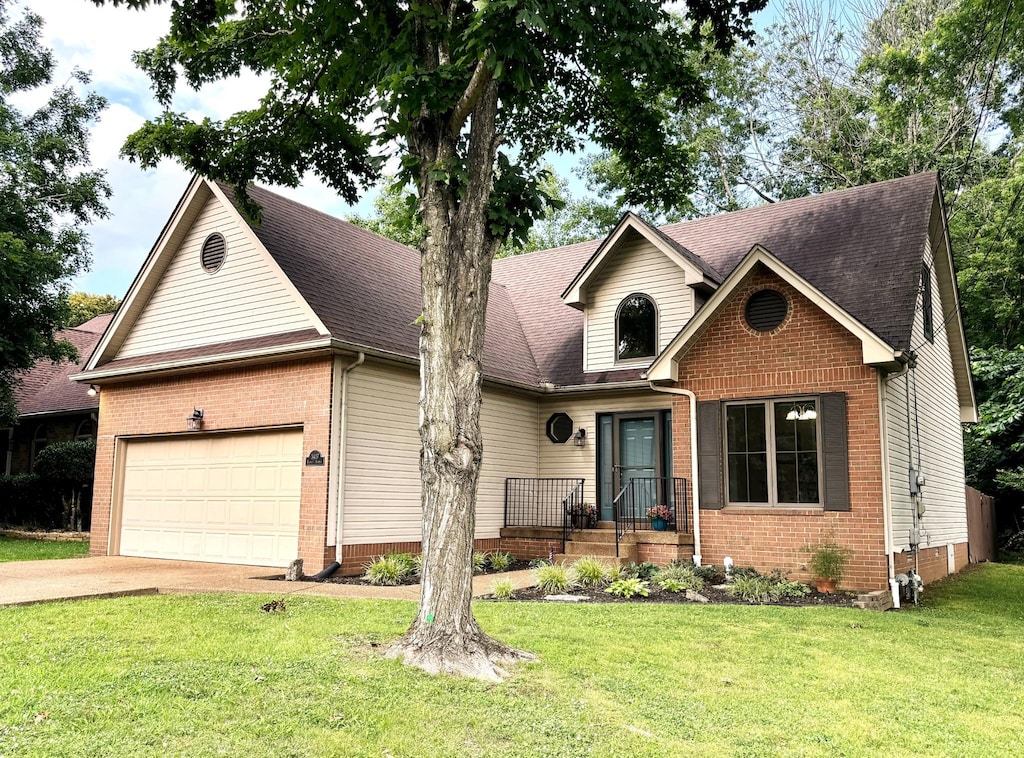 3417 Cobble St, Nashville, TN 37211 - traditional home featuring brick siding, roof with shingles, and a front yard