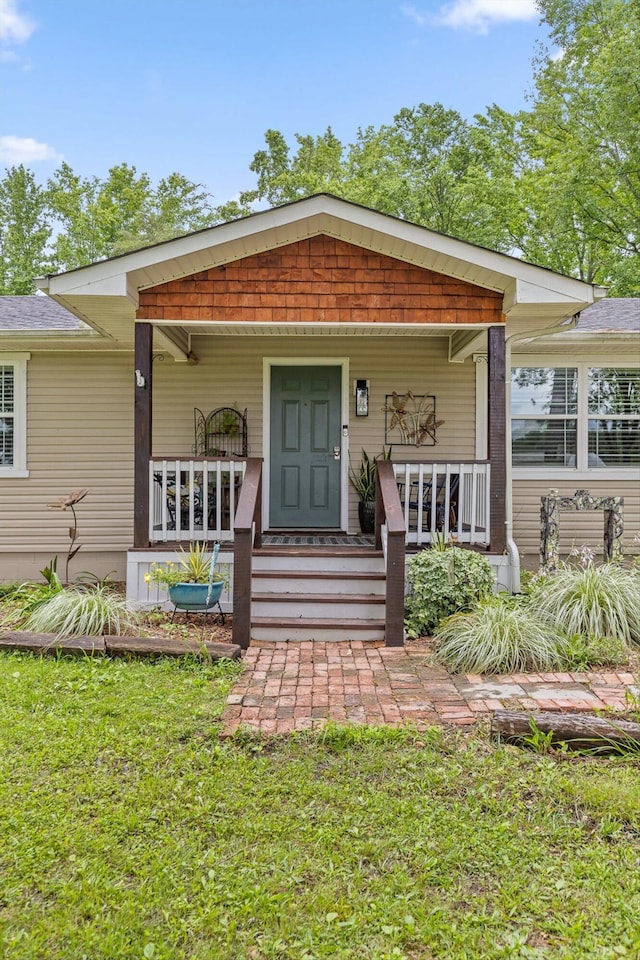 1060 Anderson Ridge Rd, Jasper, TN 37347 - view of front facade with covered porch and a front lawn