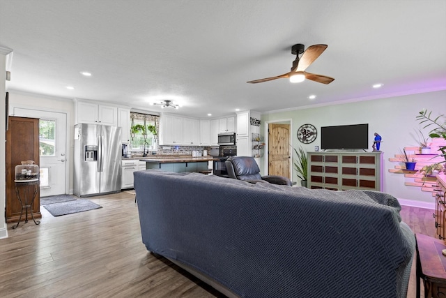 1060 Anderson Ridge Rd, Jasper, TN 37347 - living area featuring ceiling fan, recessed lighting, light wood-type flooring, and ornamental molding