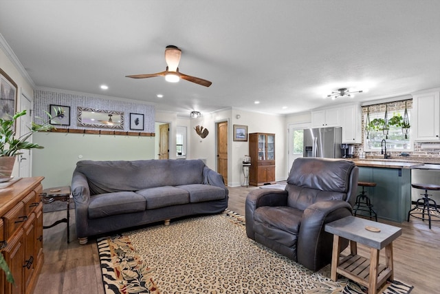 1060 Anderson Ridge Rd, Jasper, TN 37347 - living room featuring ceiling fan, light wood-style flooring, crown molding, and recessed lighting