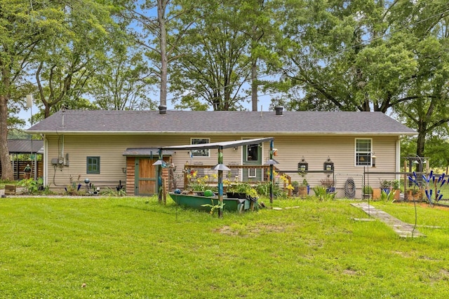 1060 Anderson Ridge Rd, Jasper, TN 37347 - rear view of house with a lawn and a storage shed