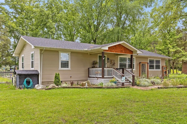1060 Anderson Ridge Rd, Jasper, TN 37347 - view of front facade with covered porch, a front lawn, and roof with shingles