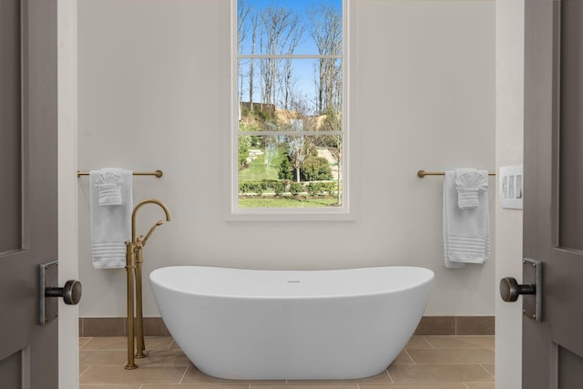 7346 Harlow Dr, College Grove, TN 37046 - full bathroom with tile patterned flooring, a freestanding bath, and plenty of natural light