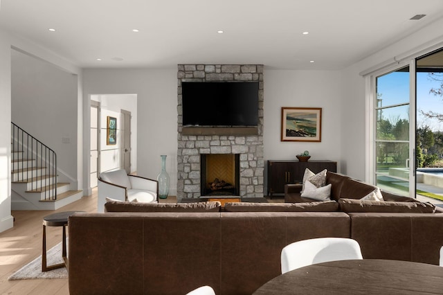 7346 Harlow Dr, College Grove, TN 37046 - living room with light wood-style floors, a fireplace, recessed lighting, and stairway