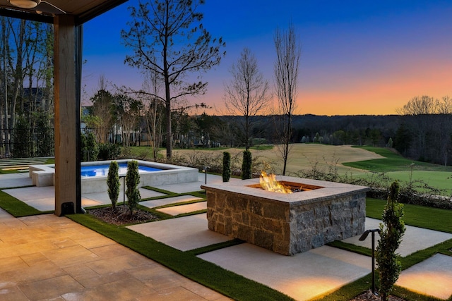 7346 Harlow Dr, College Grove, TN 37046 - patio terrace at dusk featuring an outdoor fire pit, an outdoor pool, and a patio area