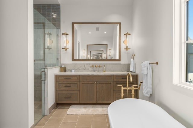 7346 Harlow Dr, College Grove, TN 37046 - bathroom featuring a soaking tub, vanity, a shower stall, and tile patterned flooring