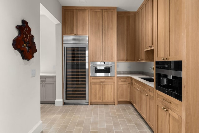 7346 Harlow Dr, College Grove, TN 37046 - kitchen with beverage cooler, light countertops, and oven