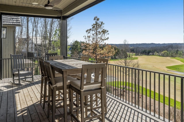 7346 Harlow Dr, College Grove, TN 37046 - wooden terrace featuring a ceiling fan, outdoor dining area, and golf course view