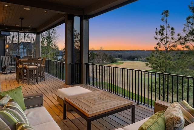 7346 Harlow Dr, College Grove, TN 37046 - deck at dusk with ceiling fan and outdoor dining space