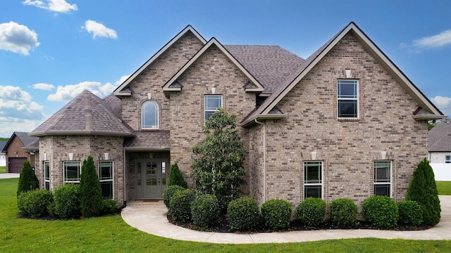 5120 Prickly Pine Pl, Murfreesboro, TN 37129 - view of front of property with brick siding, a front lawn, and a shingled roof