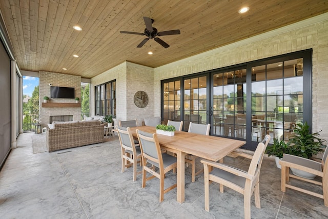 1208 Potter Ln, Gallatin, TN 37066 - view of patio with an outdoor living space with a fireplace, outdoor dining area, and ceiling fan