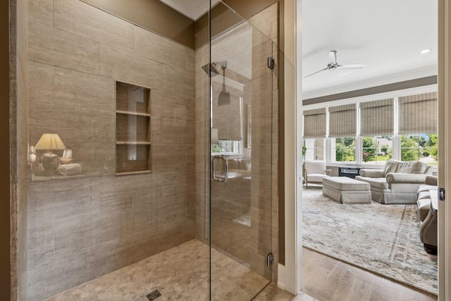 1208 Potter Ln, Gallatin, TN 37066 - bathroom with ornamental molding, ceiling fan, a stall shower, and wood finished floors