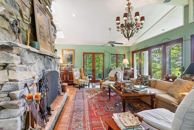 232 Hollingsworth Cove Rd, Monteagle, TN 37356 - living area featuring light wood finished floors, a ceiling fan, healthy amount of natural light, vaulted ceiling, and a large fireplace