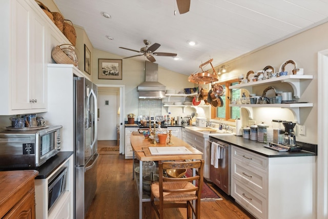 232 Hollingsworth Cove Rd, Monteagle, TN 37356 - kitchen with wall chimney range hood, ceiling fan, dark countertops, open shelves, and dark wood-style flooring