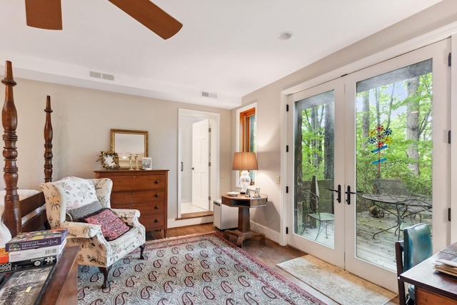 232 Hollingsworth Cove Rd, Monteagle, TN 37356 - sitting room with wood finished floors, ceiling fan, and french doors