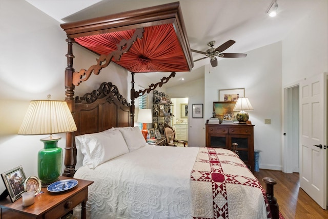 232 Hollingsworth Cove Rd, Monteagle, TN 37356 - bedroom featuring vaulted ceiling, wood finished floors, and connected bathroom
