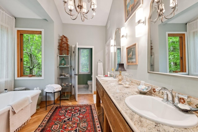232 Hollingsworth Cove Rd, Monteagle, TN 37356 - bathroom with a chandelier, a soaking tub, healthy amount of natural light, and double vanity