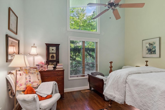 232 Hollingsworth Cove Rd, Monteagle, TN 37356 - bedroom with a towering ceiling, dark wood-style floors, and a ceiling fan