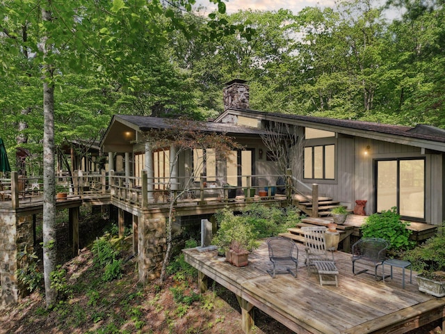 232 Hollingsworth Cove Rd, Monteagle, TN 37356 - back of property featuring a deck, a chimney, and stairs
