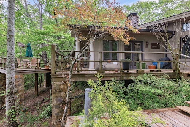 232 Hollingsworth Cove Rd, Monteagle, TN 37356 - back of property featuring a deck, a chimney, and stucco siding