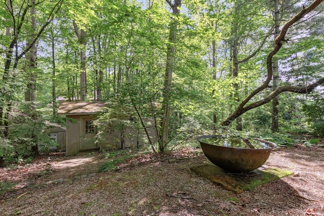 232 Hollingsworth Cove Rd, Monteagle, TN 37356 - view of yard with an outdoor structure and a wooded view
