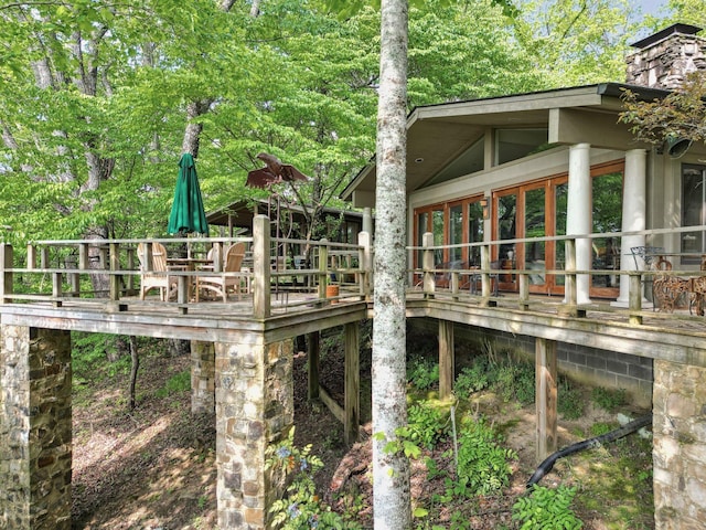 232 Hollingsworth Cove Rd, Monteagle, TN 37356 - view of property exterior featuring a wooden deck and a chimney