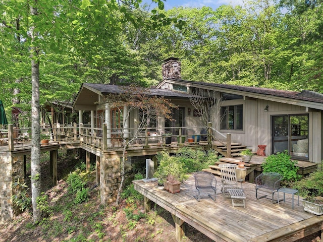 232 Hollingsworth Cove Rd, Monteagle, TN 37356 - back of property featuring a wooden deck, a chimney, and stairs