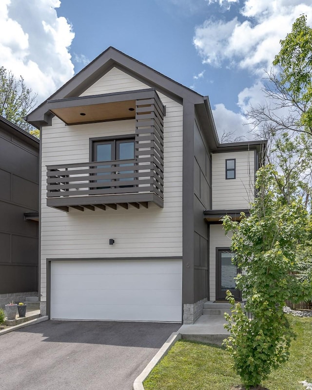 206 Ben Allen Rd Unit 5, Nashville, TN 37207 - view of front facade with a garage, a balcony, and asphalt driveway