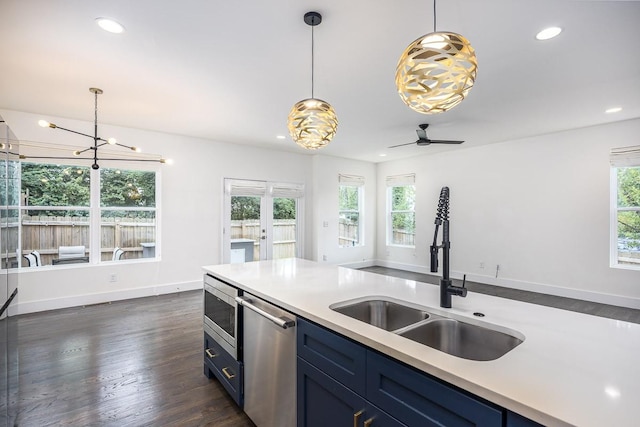 206 Ben Allen Rd Unit 5, Nashville, TN 37207 - kitchen featuring stainless steel appliances, blue cabinets, light countertops, decorative light fixtures, and recessed lighting