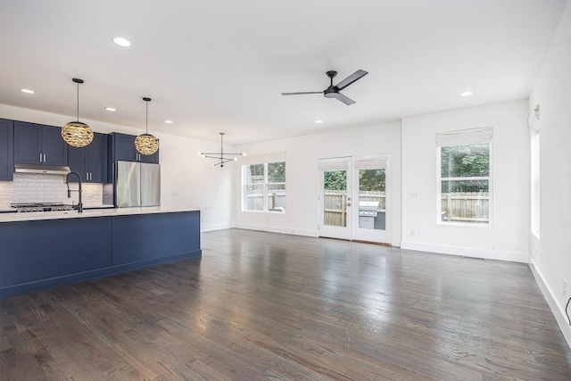 206 Ben Allen Rd Unit 5, Nashville, TN 37207 - unfurnished living room featuring a ceiling fan, dark wood-style floors, recessed lighting, and a chandelier