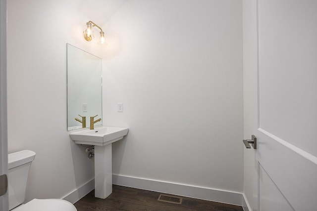 206 Ben Allen Rd Unit 5, Nashville, TN 37207 - bathroom with baseboards and wood finished floors